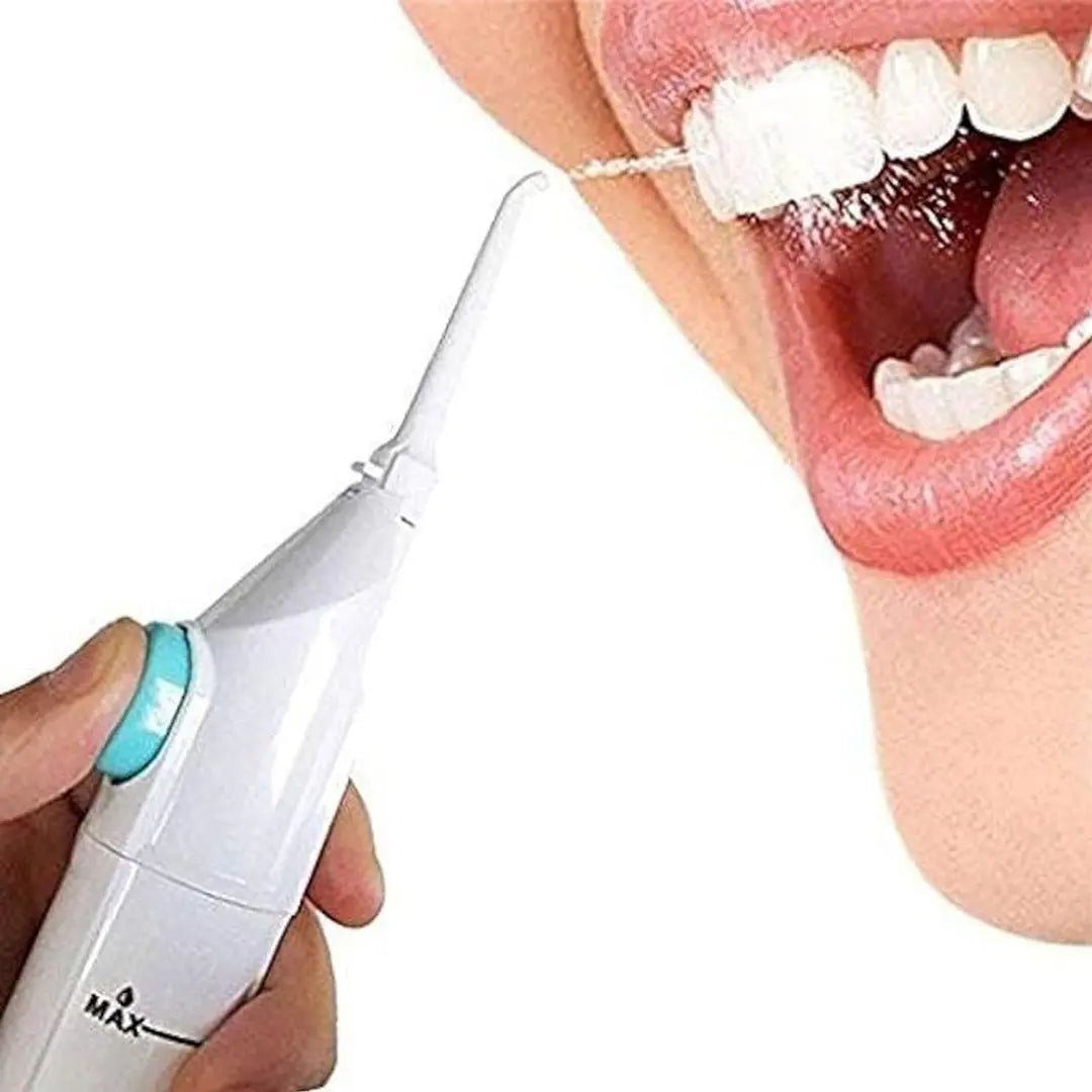 Portable water flosser tool for cleaning between teeth and gums